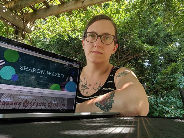 sharon wasko graphic designer with computer